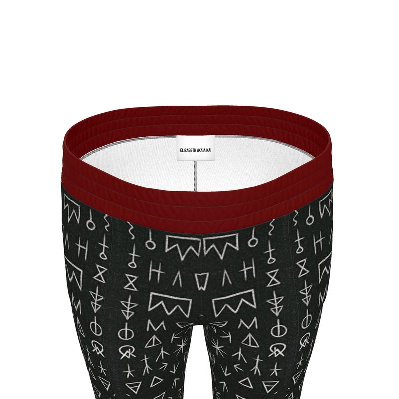 Gros plan sur la ceinture contrastée bordeaux du Bas de survêtement Boma. Élégance et confort réunis dans une pièce afro-luxe à la demande.