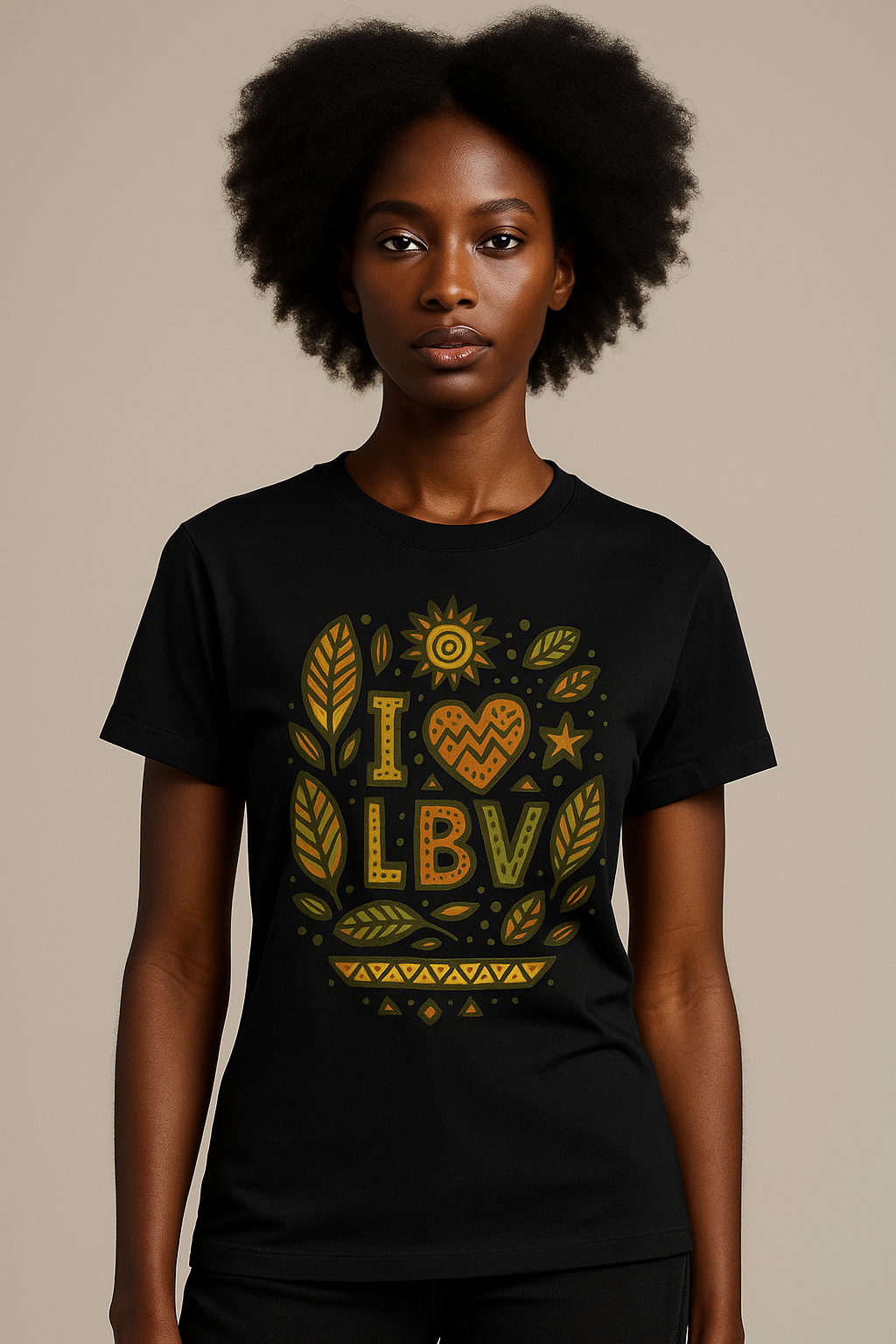 T-shirt noir en coton bio motif “I ❤ LBV” avec imprimé feuilles badamier vert et orange – mode afro-luxe.