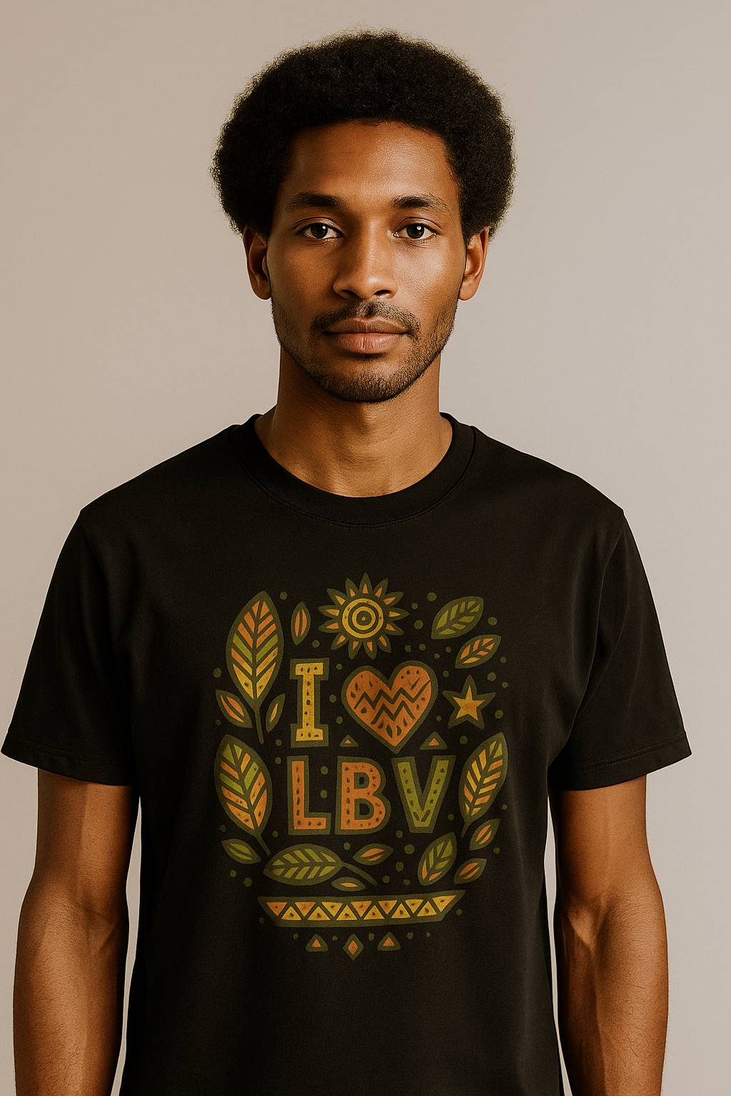 T-shirt noir en coton bio motif “I ❤ LBV” avec imprimé feuilles badamier vert et orange – mode afro-luxe.