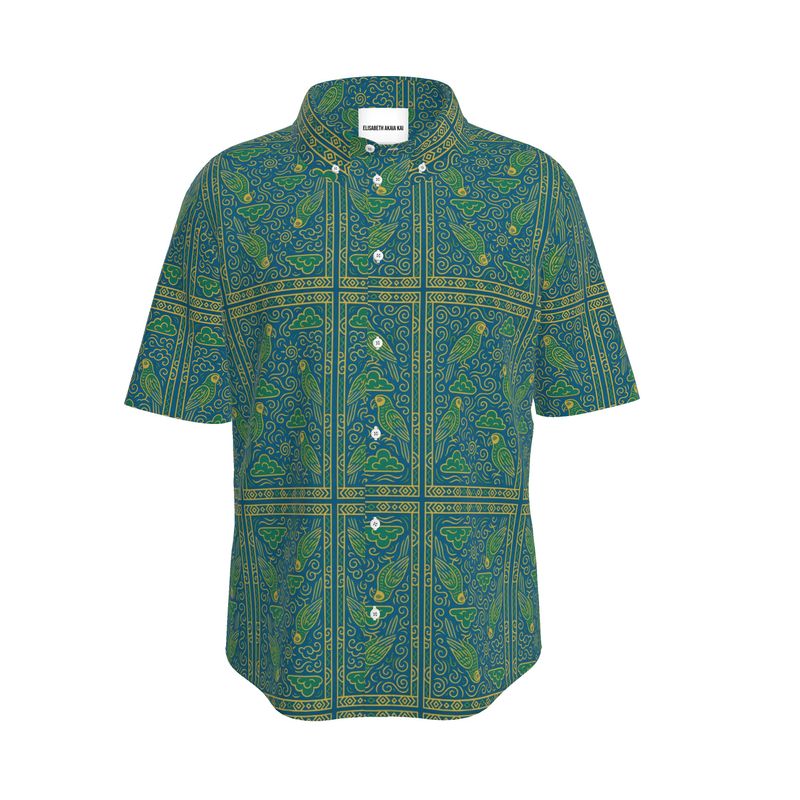 Vue avant de la chemise Okani, collection Libreville Royale. Design gabonais artistique, coupe élégante, boutons en nacre et tissu de luxe.