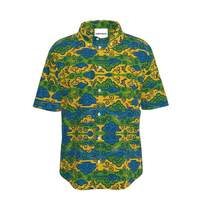La chemise dans sa pureté. Motif graphique bleu-vert-or, coupe impeccable, boutons nacrés : le luxe se révèle dans le détail.