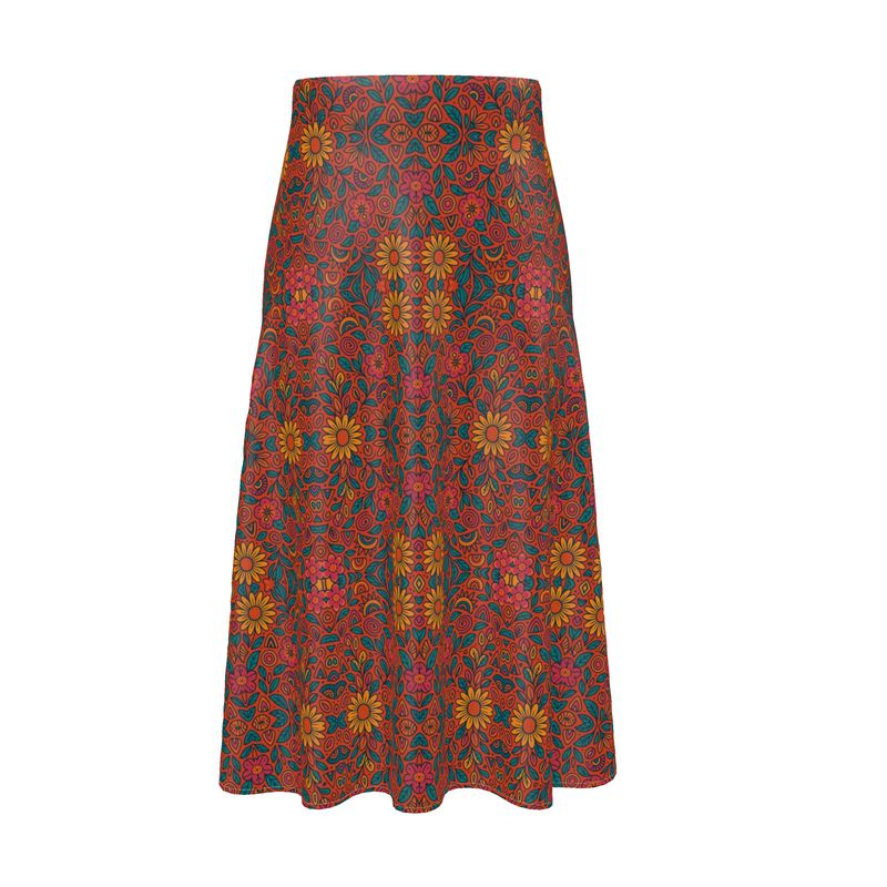 Jupe midi fluide imprimée aux motifs floraux solaires, coupe taille haute, portée par une femme en look bohème chic – Collection estivale Élisabeth Akaïa Kaï