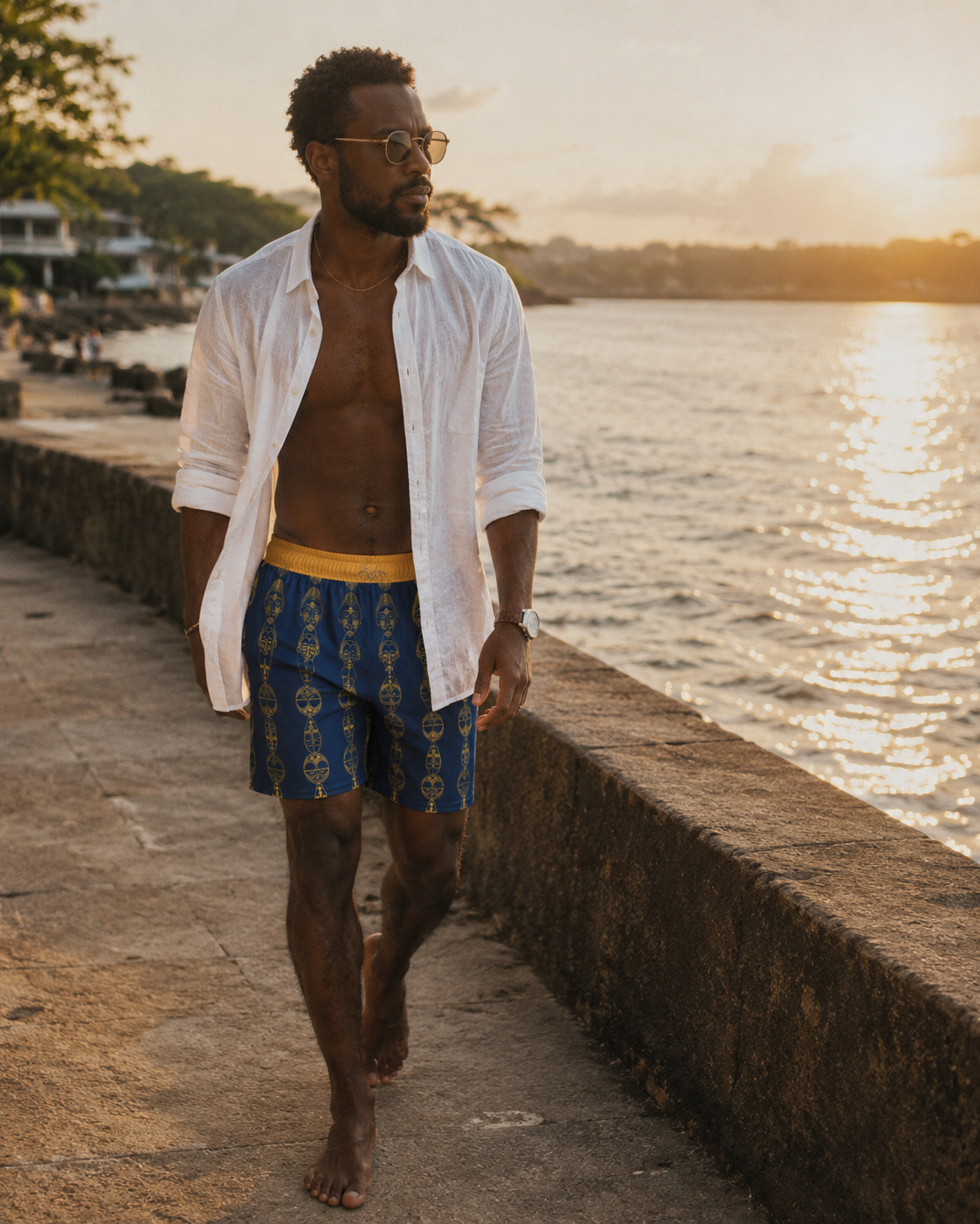 Le short Mebeghe Éternel accompagne les instants suspendus entre ville et océan. Une silhouette sophistiquée qui conjugue artisanat, héritage africain et luxe contemporain.