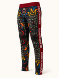 Pantalon de survêtement homme MIENGO SEKIANI présenté de trois quarts, imprimé artistique multicolore sur fond ivoire.